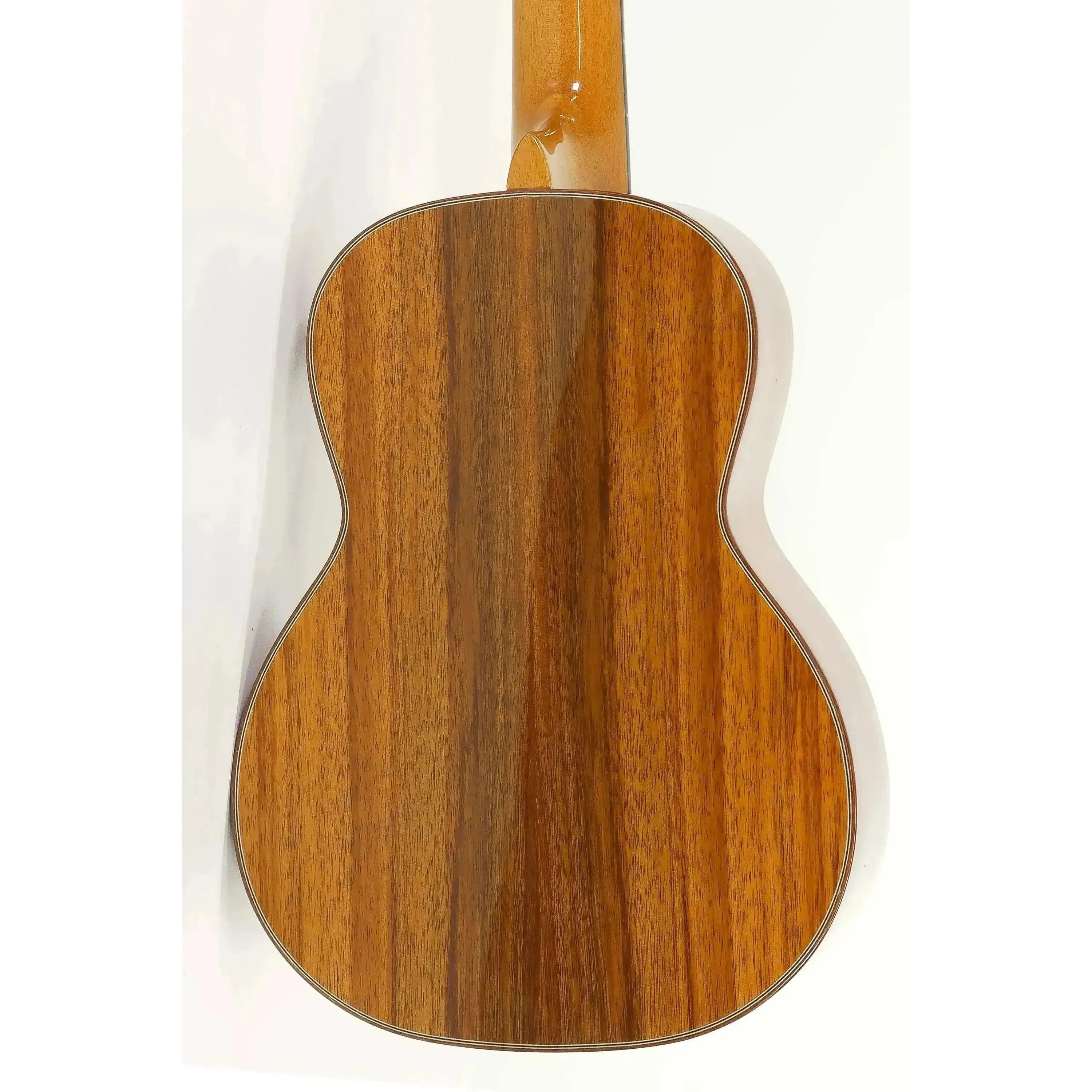 Back of an Ohana TK-350G tenor ukulele, showcasing its glossy solid Hawaiian Koa wood and elegant mahogany binding.