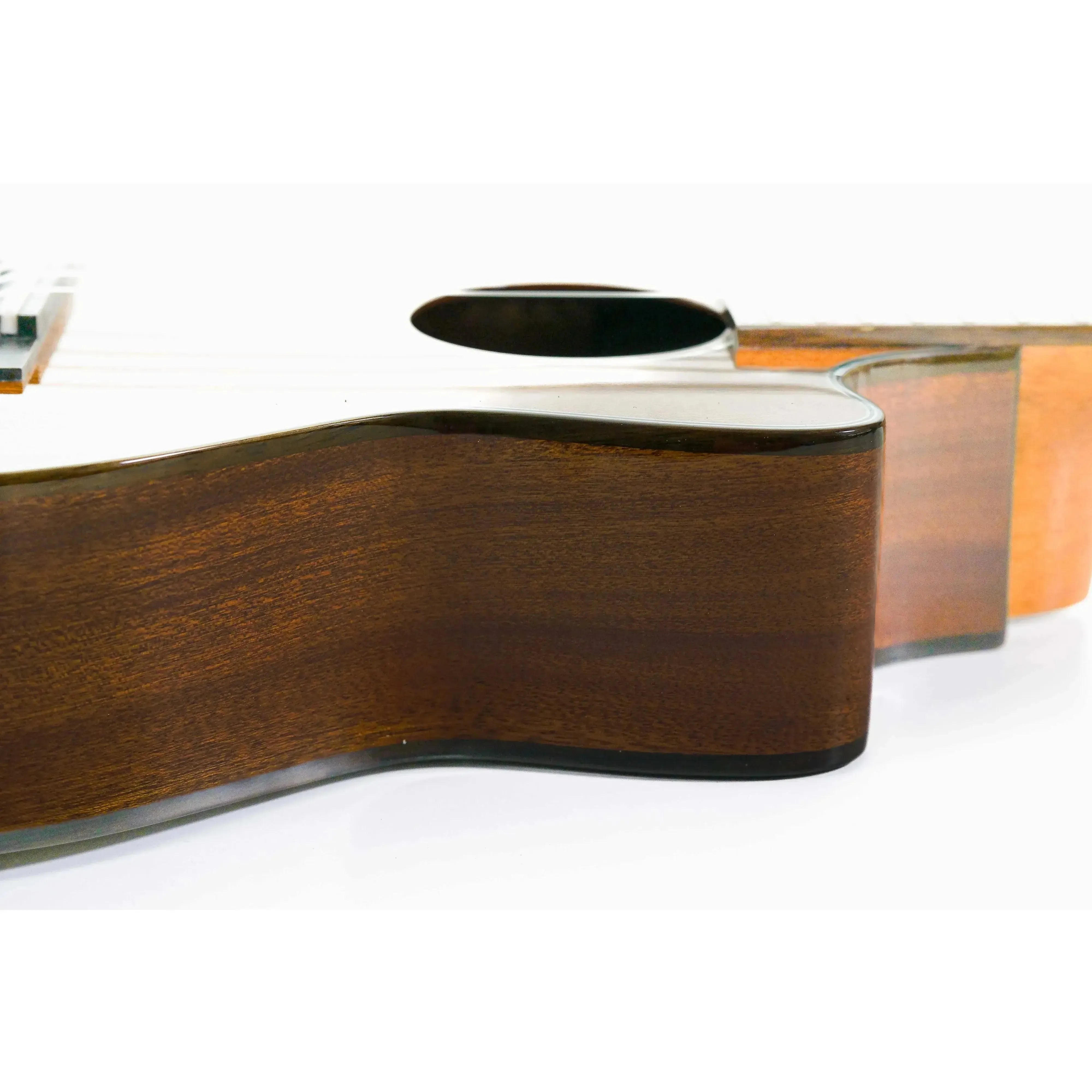 Ohana TK-35GCE solid mahogany tenor ukulele body with dark wood grain and glossy finish.