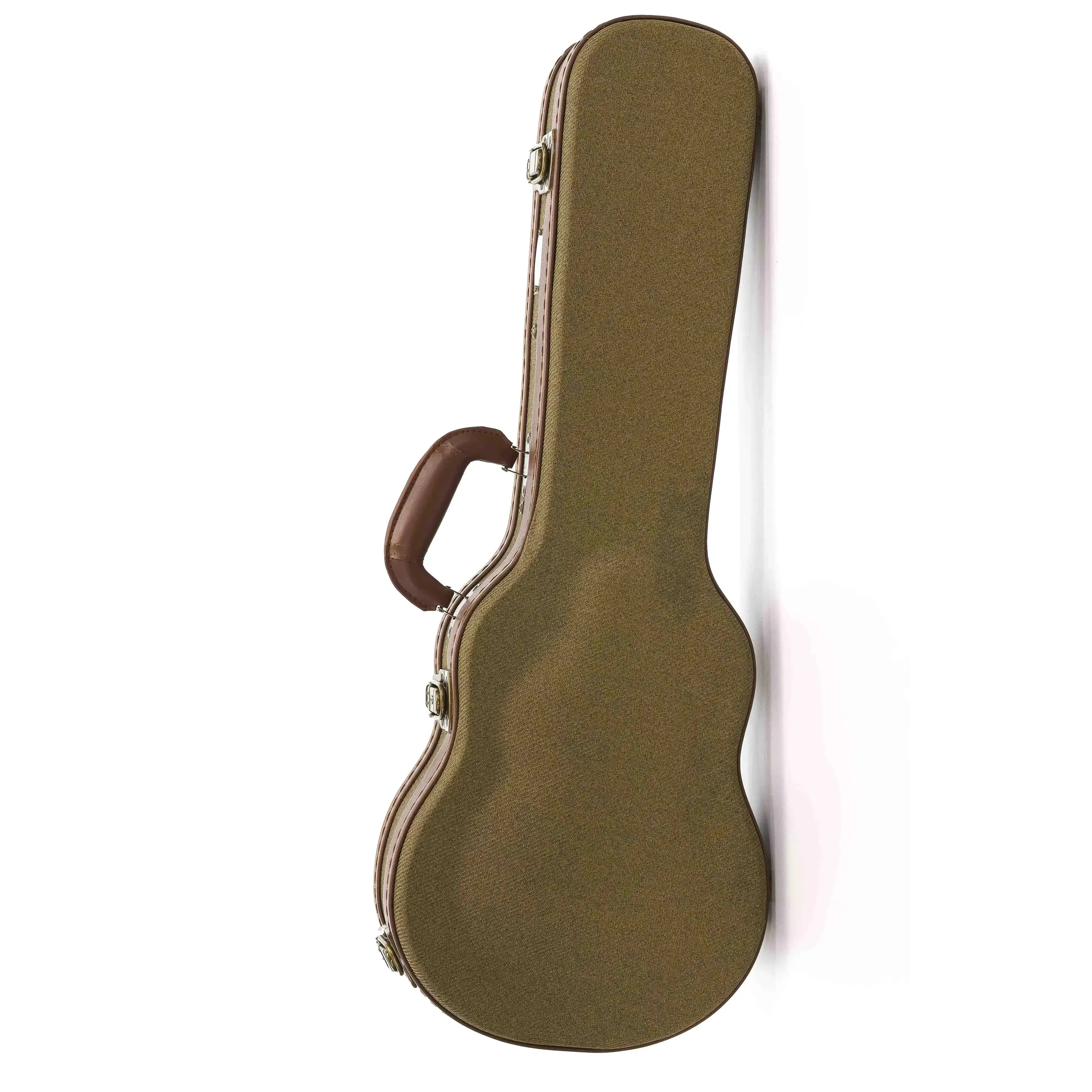 Brown Ohana ukulele hard case with a leather handle and metal latches, leaning against a white wall.