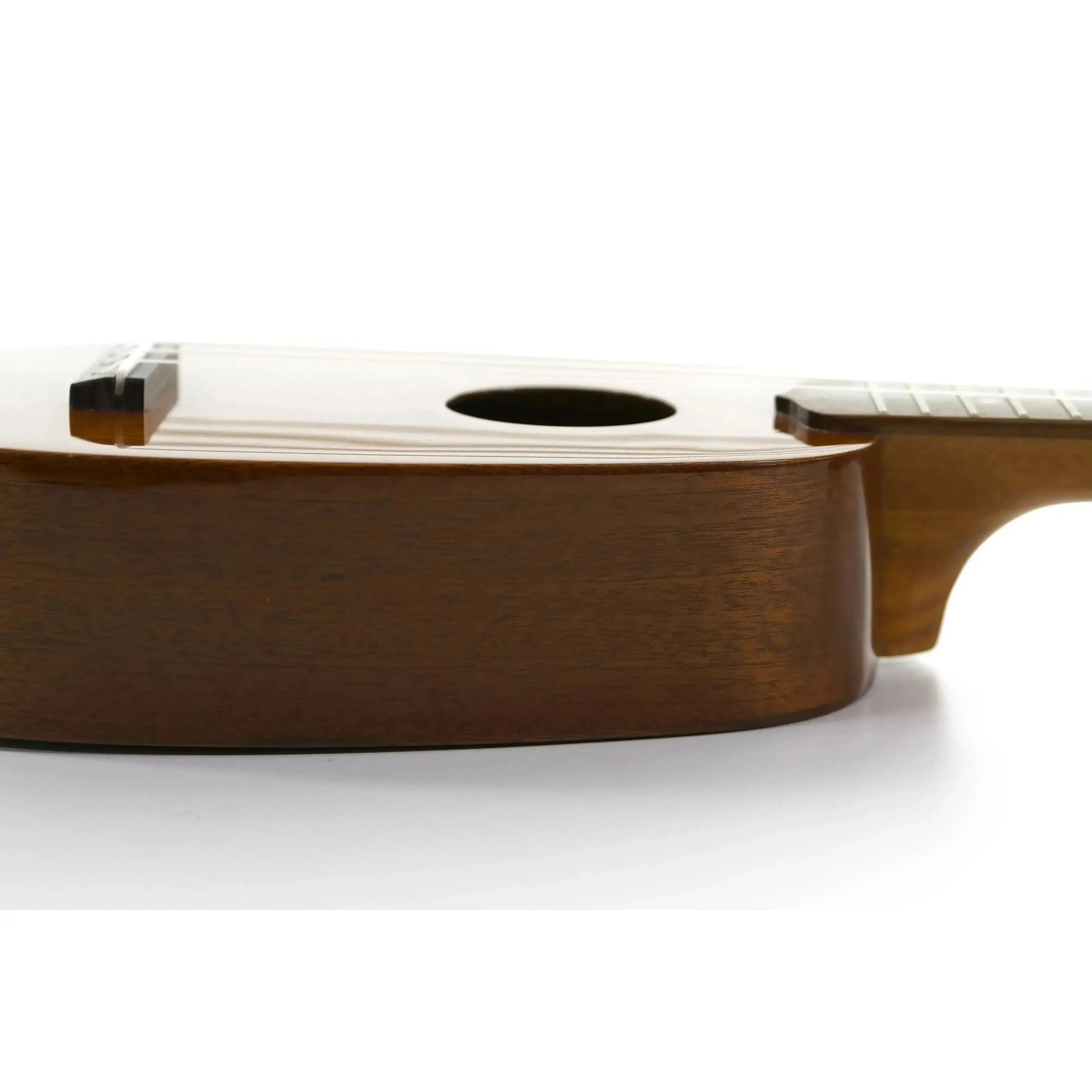 Ohana TPK-25G solid mahogany pineapple sopranino ukulele body with gloss finish.