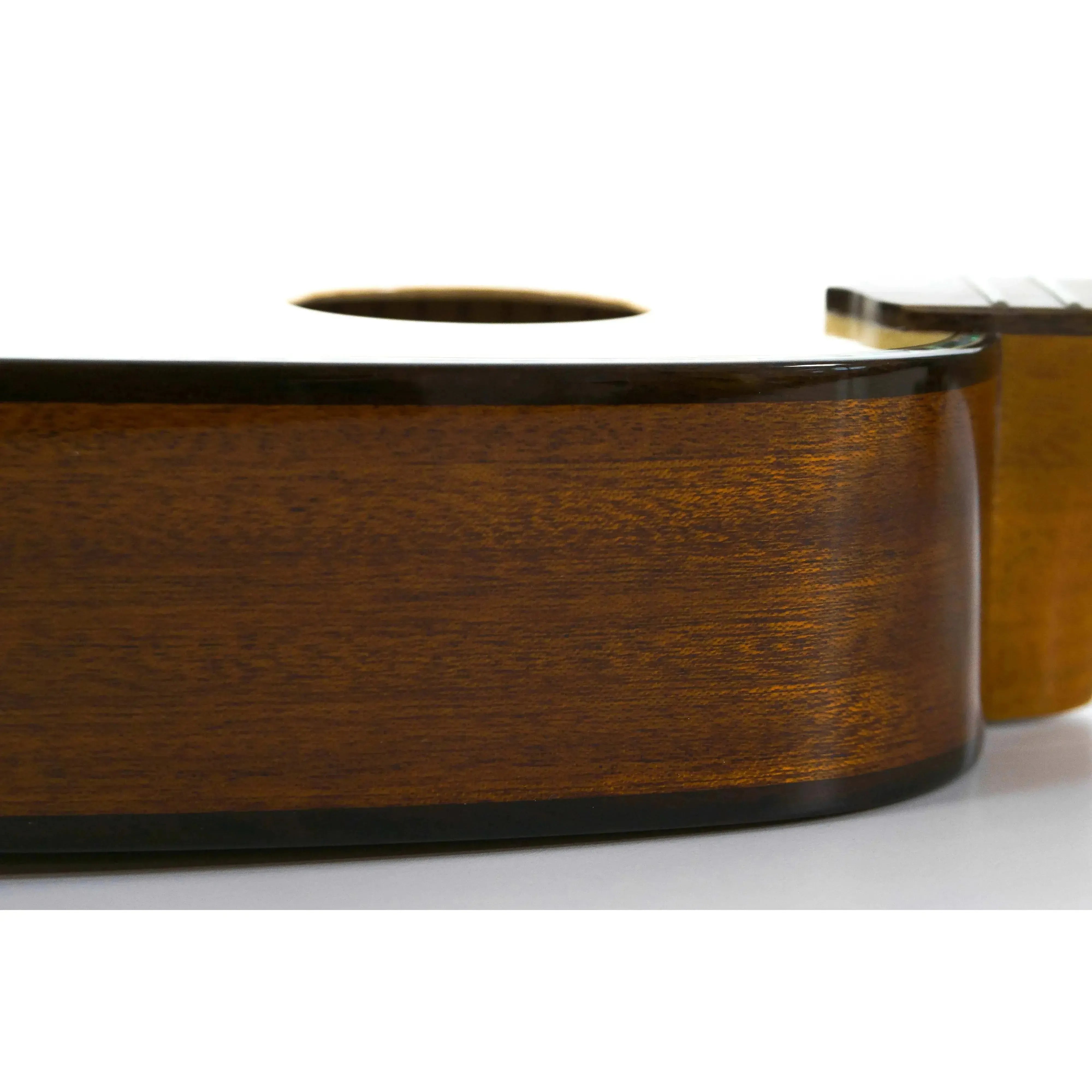 Ohana TPK-70G Pineapple Sopranino Ukulele body, dark mahogany wood with gloss finish.