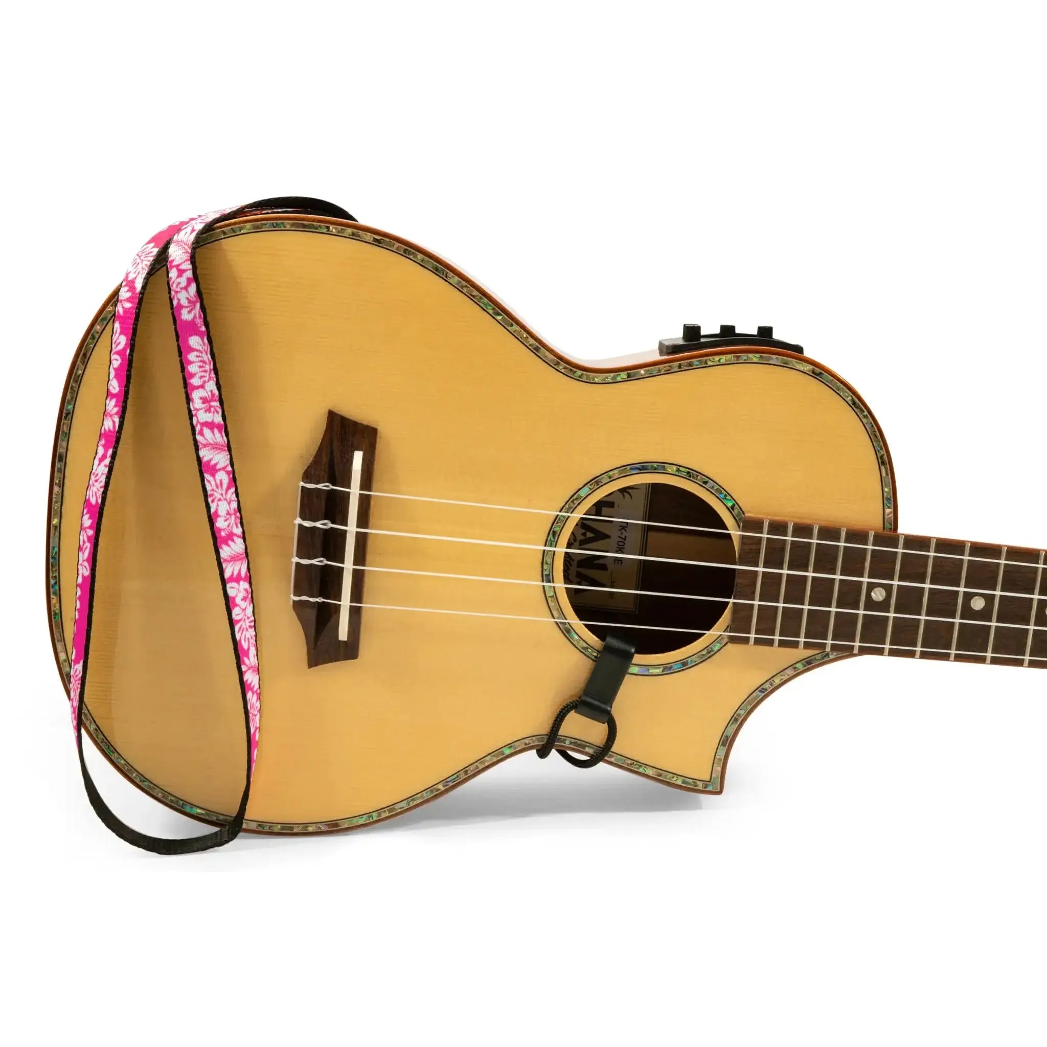 Ohana USS-04 ukulele sound hole strap, fuchsia floral polyester, 0.5" wide, on a light wood ukulele.