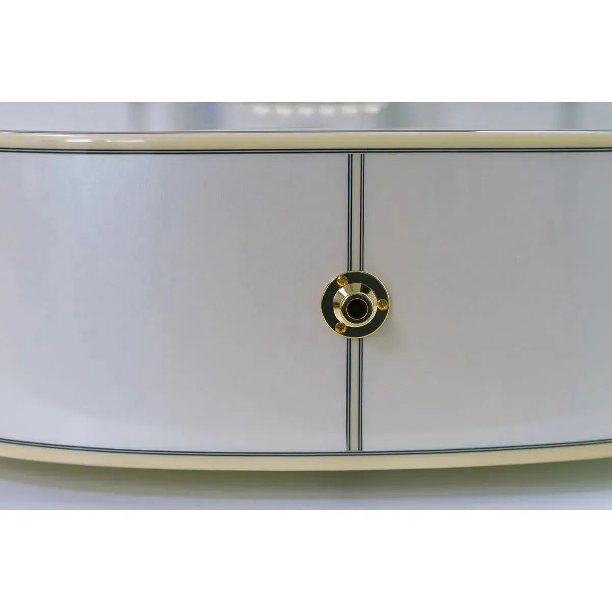 Close-up of Takamine GD37CE PW acoustic-electric guitar's pearl white body with gold output jack.