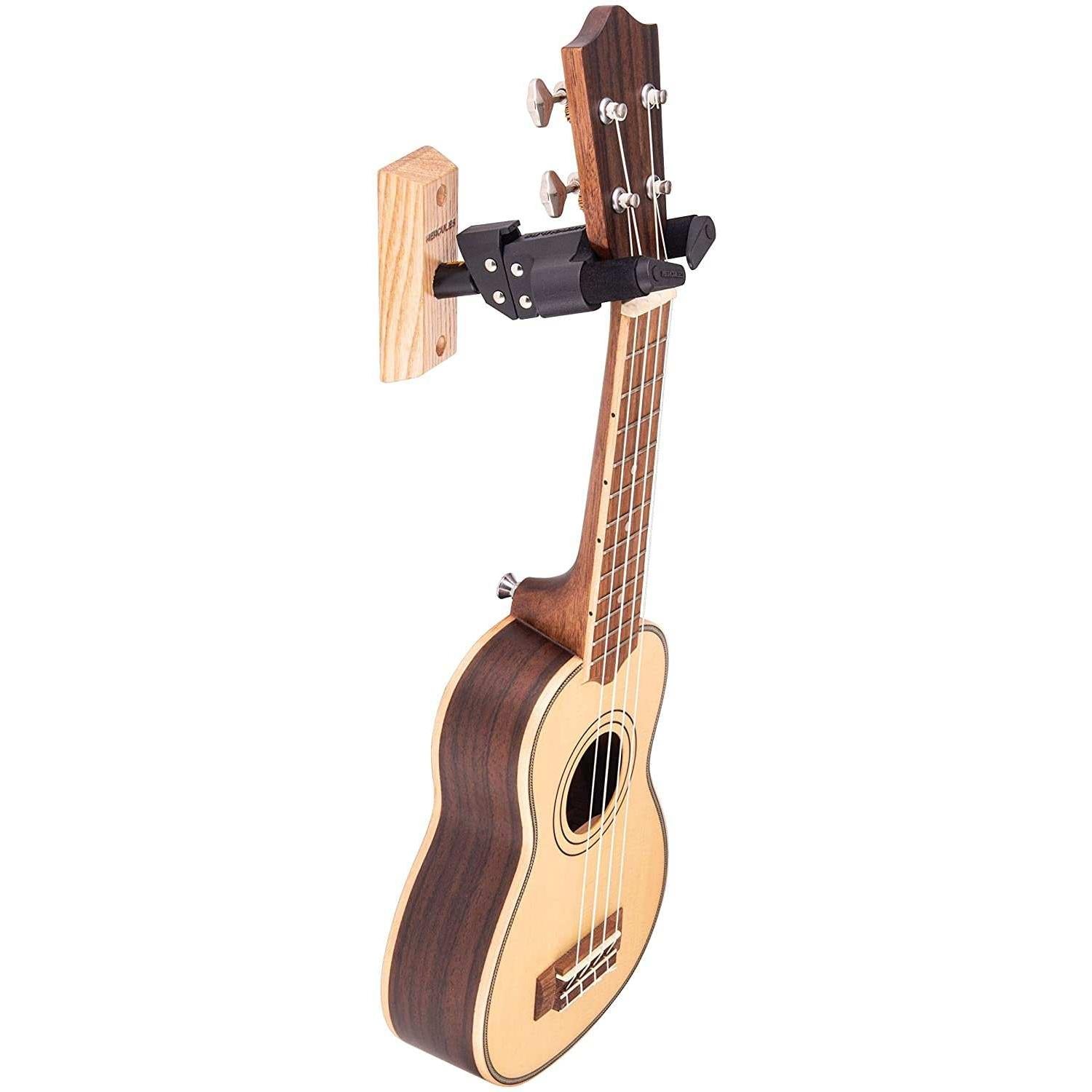 Ukulele with natural wood finish on wall hanger, Terry Carter Music Store
