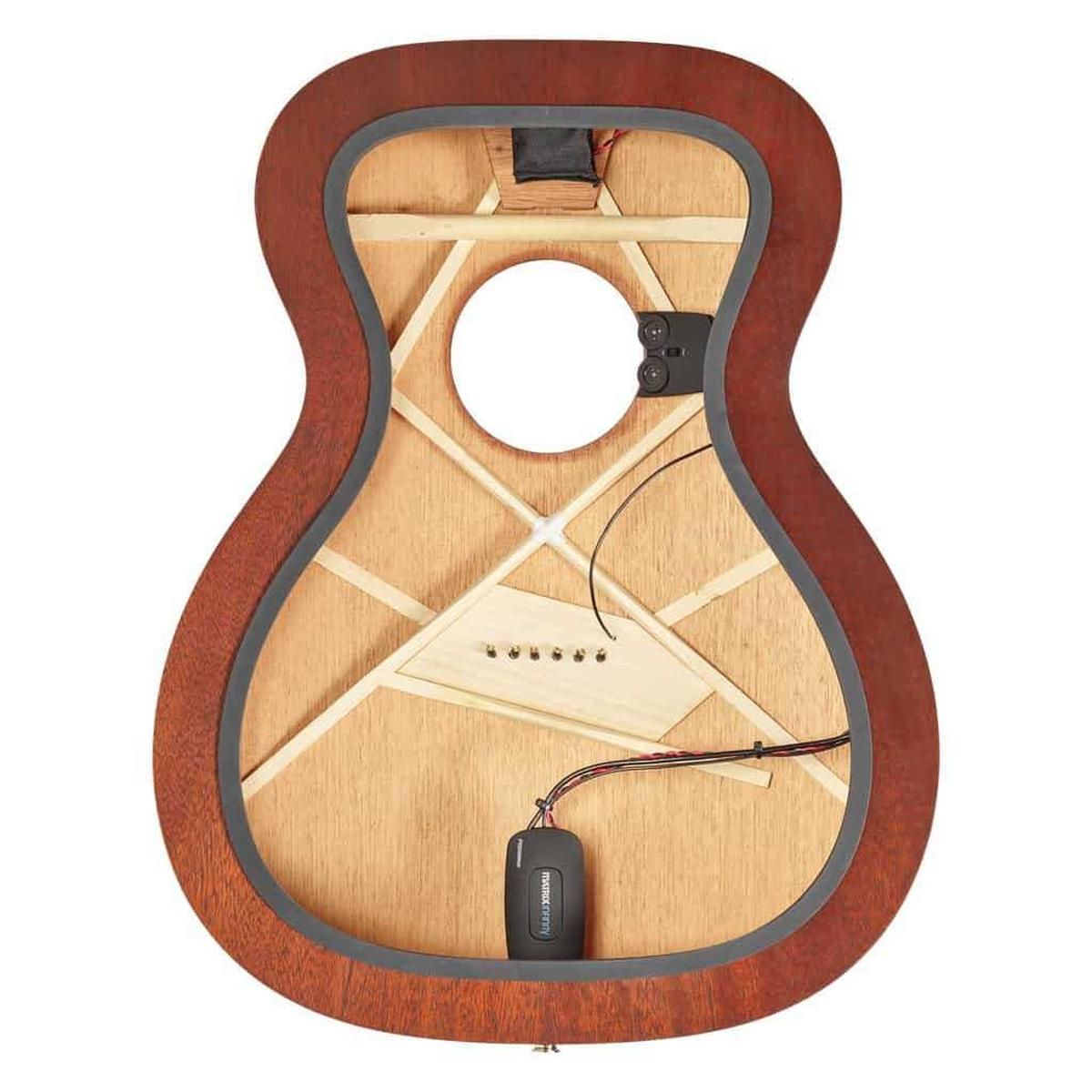 Inside view of mahogany acoustic guitar body with pickup system at Terry Carter Music Store