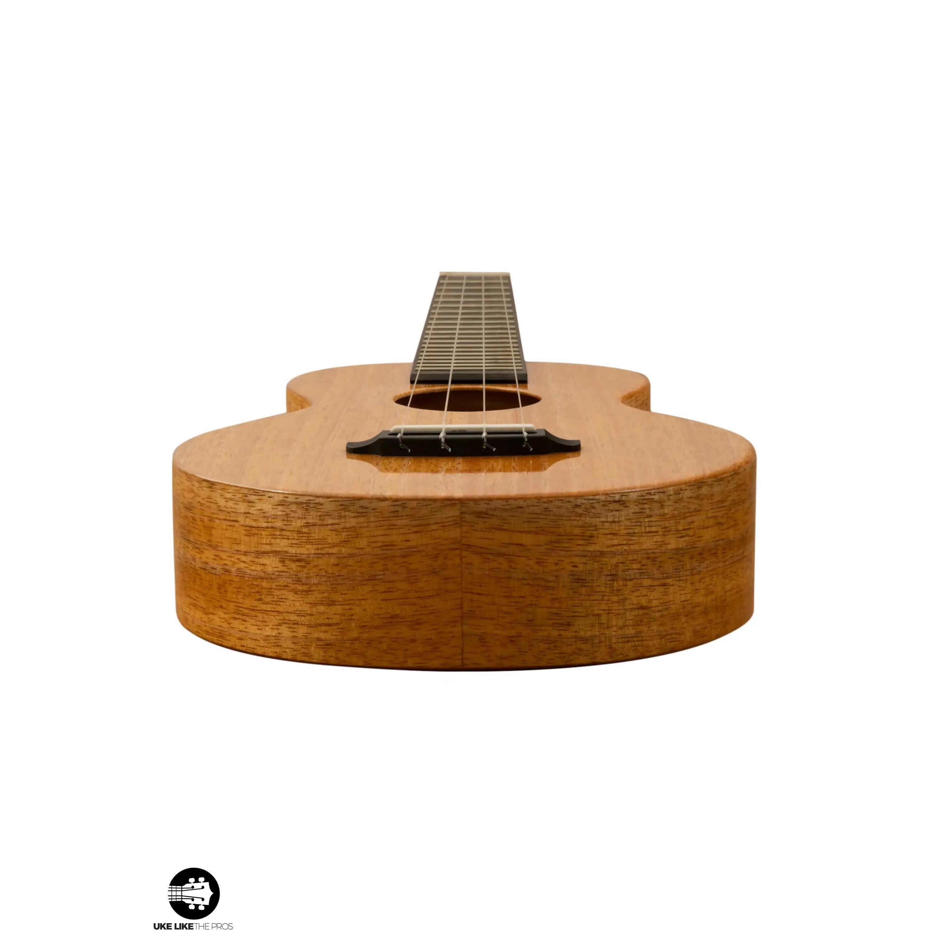 Romero Creations ukulele with natural wood finish on white background at Terry Carter Music Store