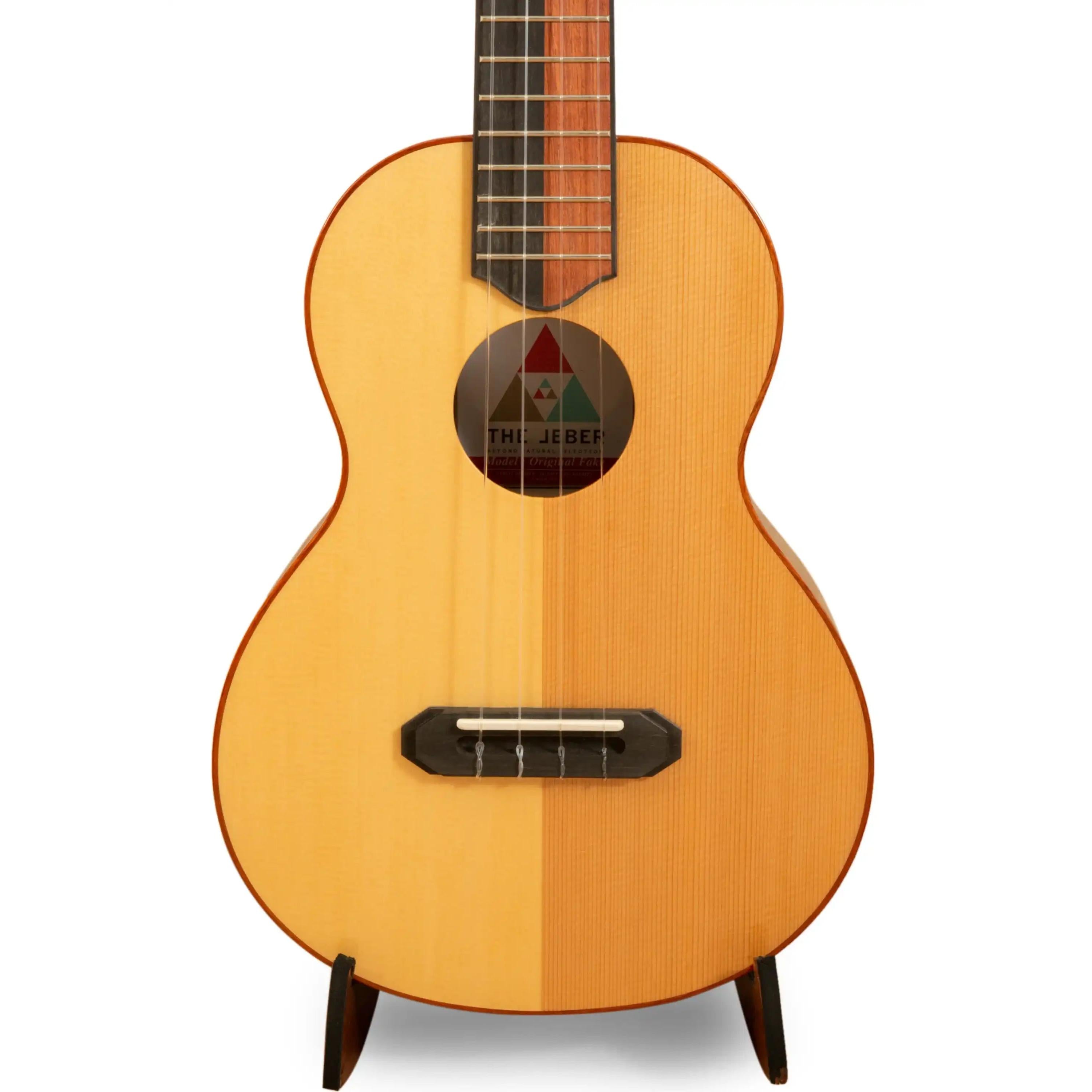 The Jebel ukulele with natural wood finish and unique two-tone spruce top at Terry Carter Music Store