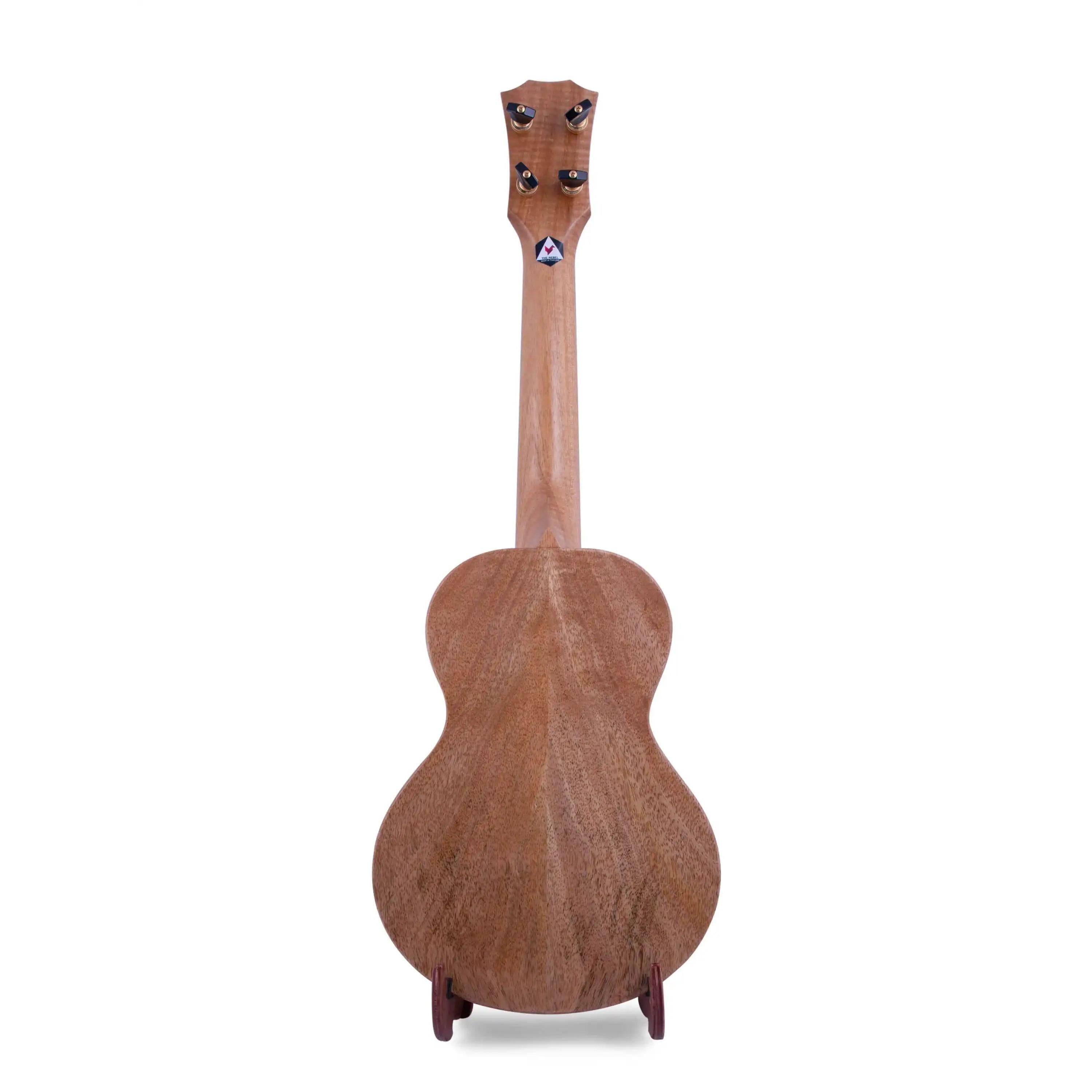 Back view of Rebel ukulele with natural wood grain, displayed at Terry Carter Music Store.